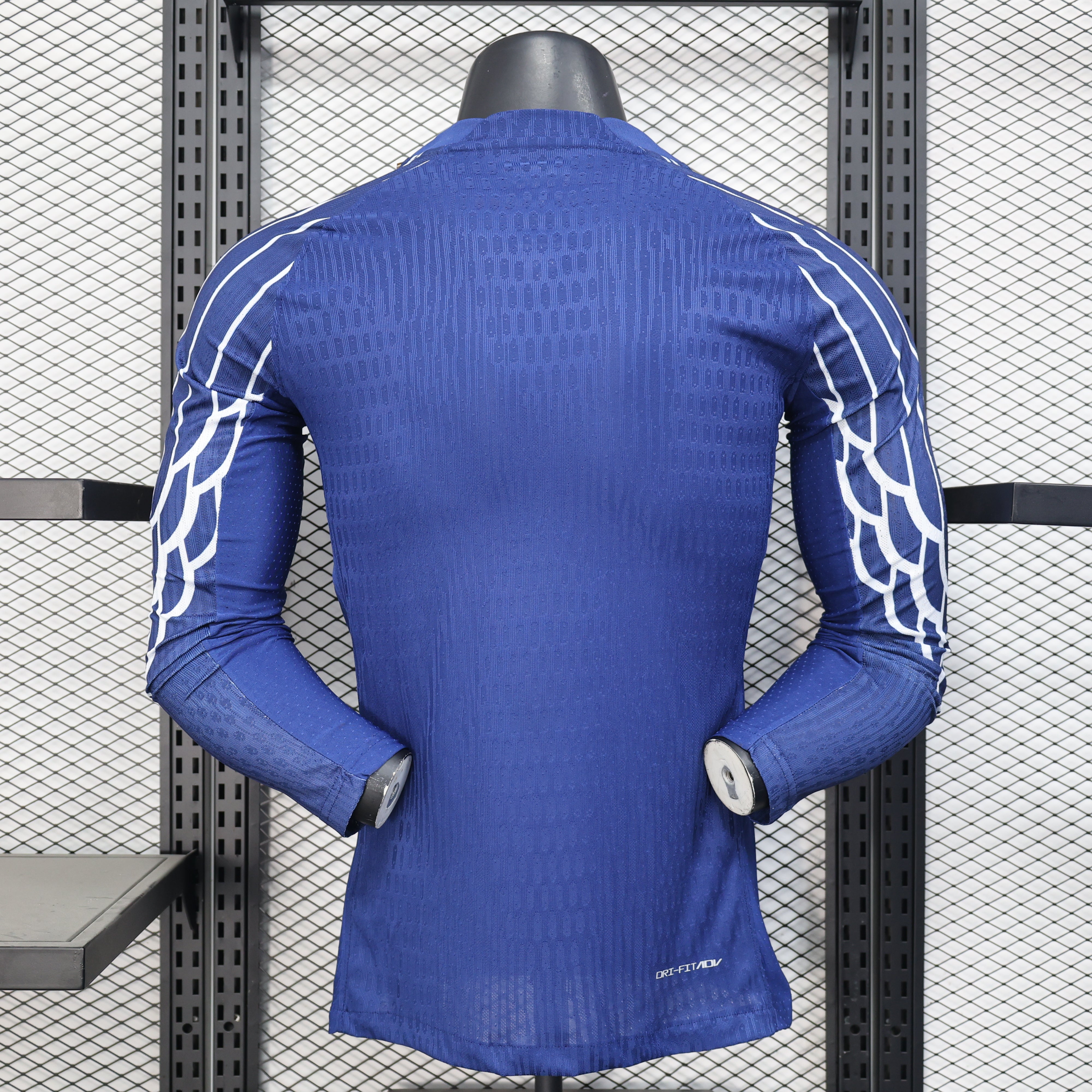 Back view of blue PSG 25/26 4th away jersey with white wing sleeves